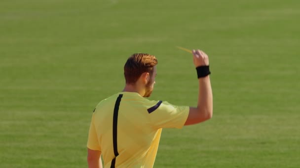 Football Soccer referee shows penalty yellow card, 4k, 75fps - Video
