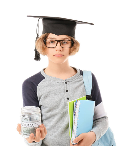 Teenage boy with savings for education on white background - Photo, Image