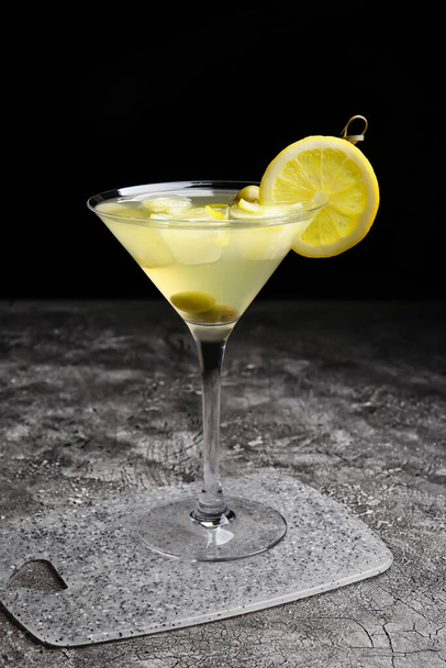 Glass of tasty martini cocktail on table - Valokuva, kuva