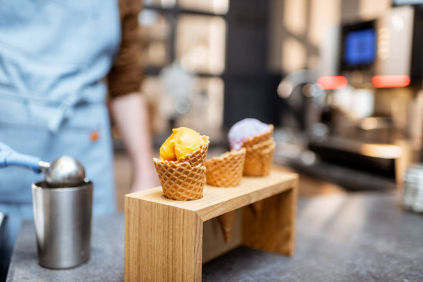 Ice cream in waffle cone on a store counter - Foto, immagini