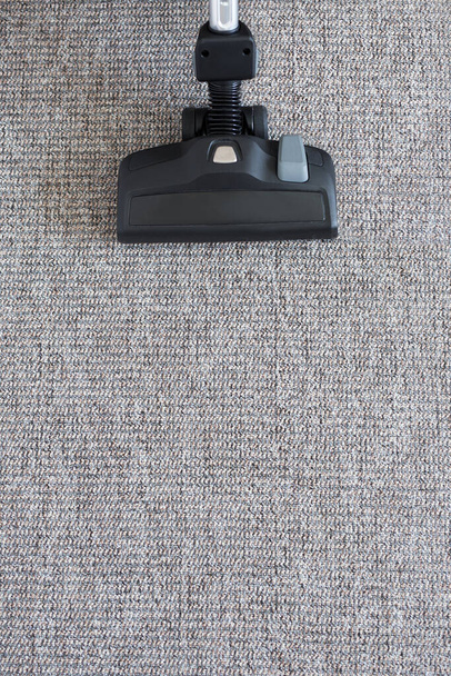 housekeeping concept - modern vacuum cleaner on carpet floor background - Photo, Image