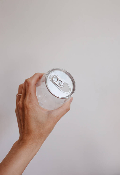 clean transparent can in the hand - Φωτογραφία, εικόνα