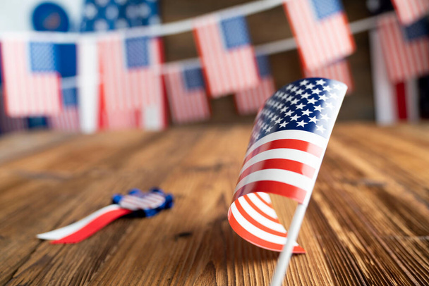 Fourth of   July. Independence Day concept. American flags on the wooden rustic table. - Foto, afbeelding