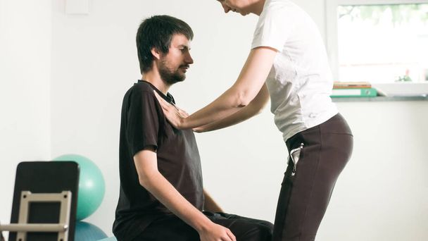 Physiotherapist with disabled person - Fotoğraf, Görsel