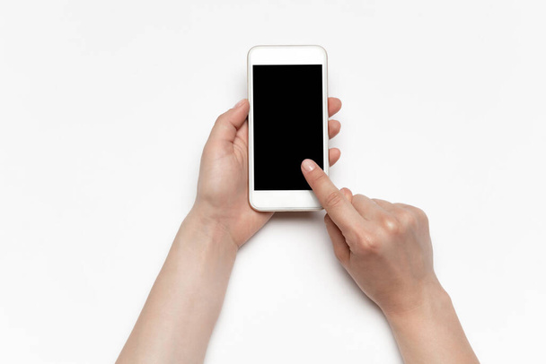 Close up of human hand using smartphone with blank black screen, education and business concept - Фото, зображення