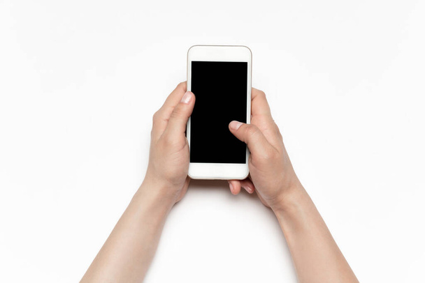 Close up of human hand using smartphone with blank black screen, education and business concept - 写真・画像