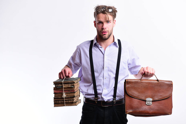 Nerd or bookworm wears suspenders. Wisehead syndrome and hard work - Zdjęcie, obraz