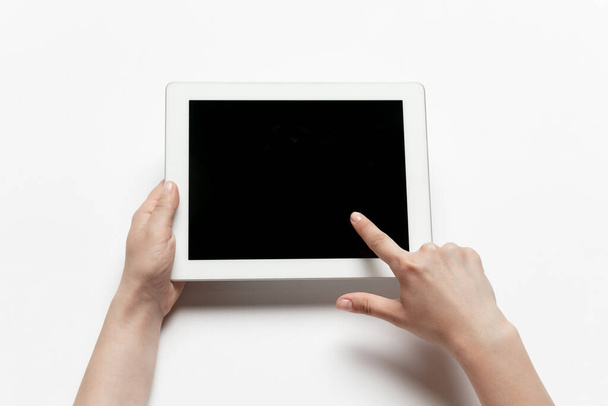 Close up of human hand using tablet with blank black screen, education and business concept - Foto, imagen