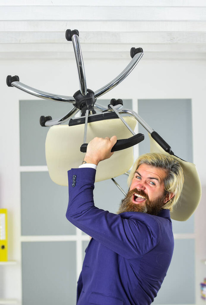 Furniture sale. Get rid of the excess. Businessman standing in office hold chair. Business man aggressive. Hipster man angry with office chair. Throw out chair. Stress concept. Crazy or mad - Fotoğraf, Görsel