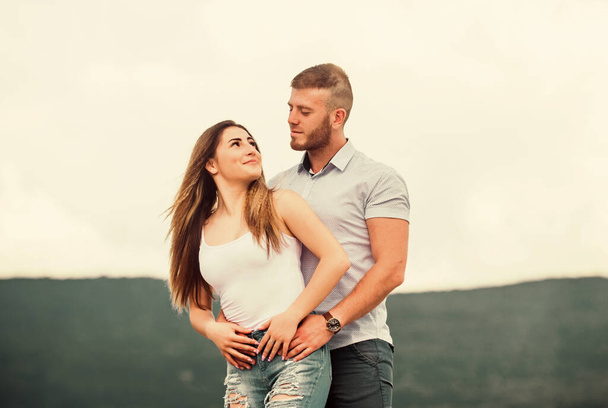 Man and woman cuddle nature background. Family love. Devotion and trust. Together forever we two. Love story. Romantic relations. Cute and sweet relationship. Couple in love. Couple goals concept - Фото, изображение
