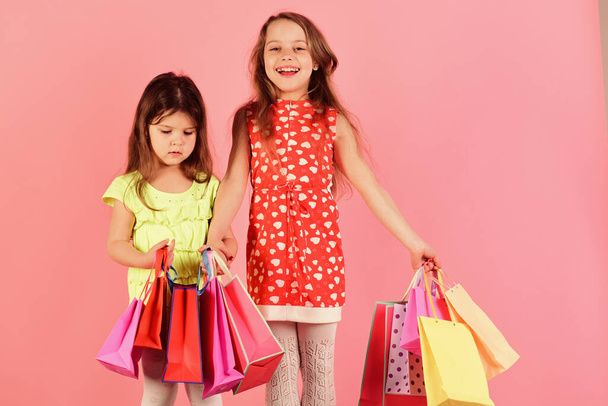 Shopaholics, childhood and fashion concept. Ladies buy clothes - Foto, immagini