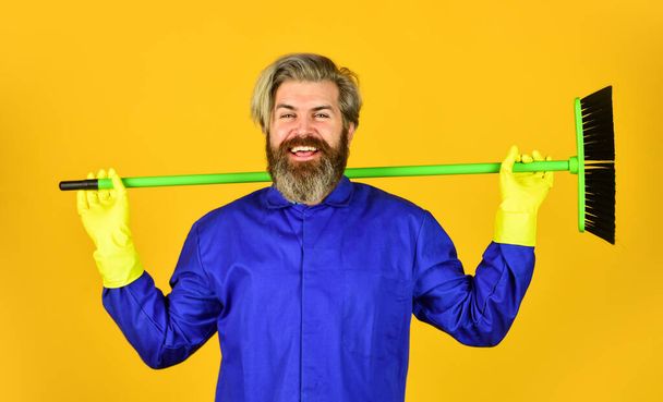 man cleaner. bearded man cleaning with mop. Janitor in gloves. husband cleaning house. Housework and domestic duty. Male janitor with cleaning supply. sweeping the floor - Photo, Image