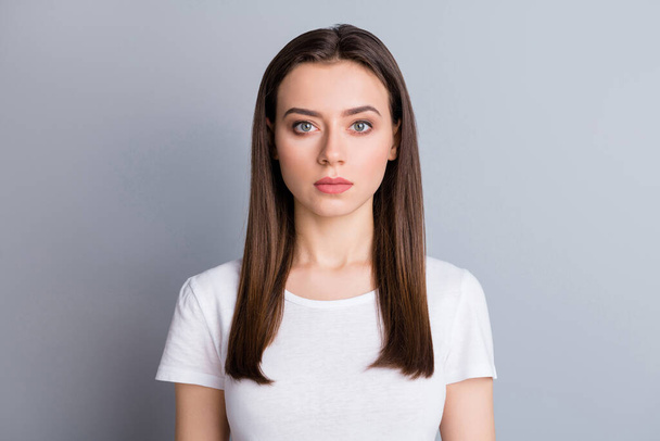 Closeup photo of attractive lady perfect groomed hairdo not smiling stay home quarantine citizen responsibility wear casual white t-shirt isolated grey color background - Fotó, kép