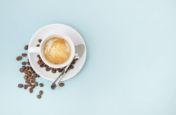 Cup of coffee on blue background - Zdjęcie, obraz