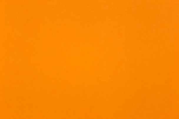 Feuille de parchemin de couleur orange à fermer pour une utilisation comme fond - Photo, image