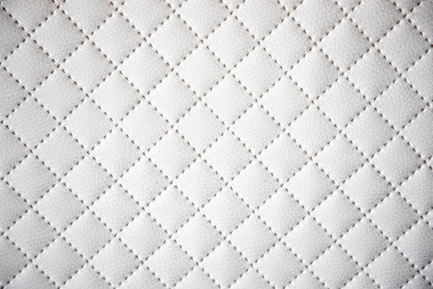 beautiful interesting original white leather background with quilting pattern - Photo, Image