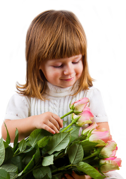 beautiful little girl with roses flowers - Фото, зображення