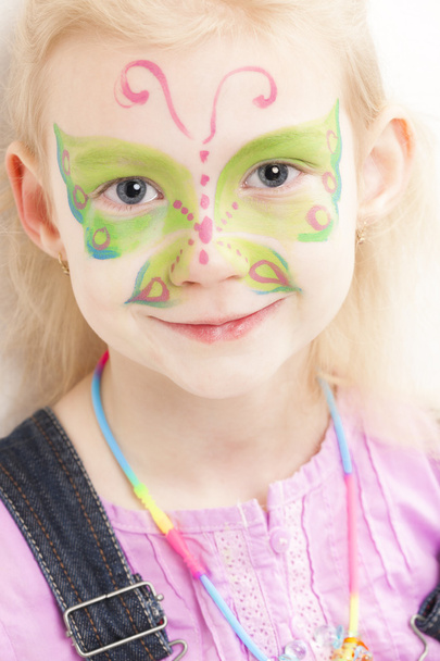 portrait of little girl with face painting - Fotó, kép