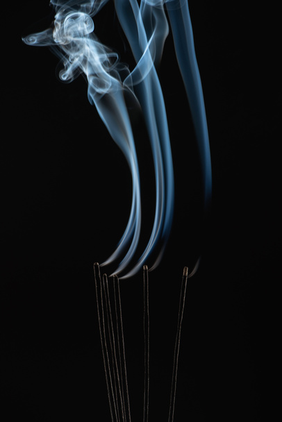 burning aroma sticks with smoke on black background - Photo, Image