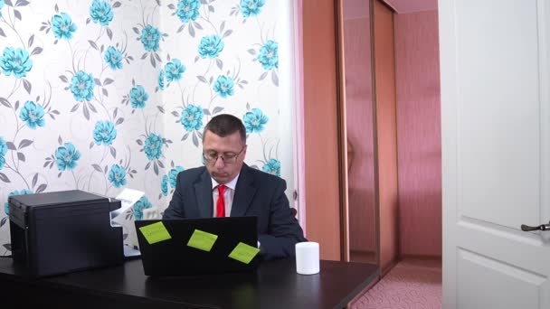 Adult businessman reads the layoff notice at home. Unemployment concept. Coronavirus aftermath. - Felvétel, videó