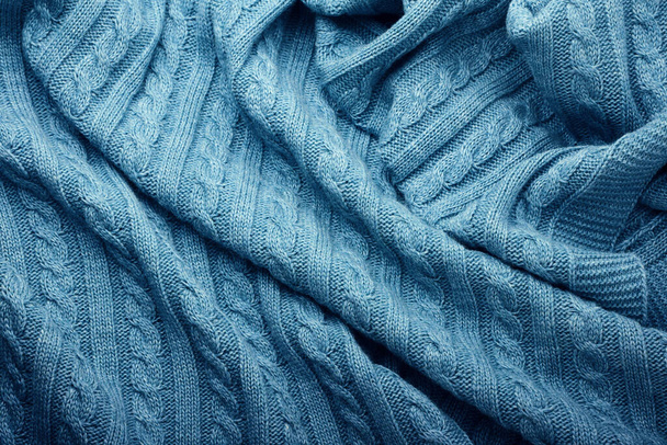 Складки вязаного шерстяного одеяла, вид сверху - Фото, изображение