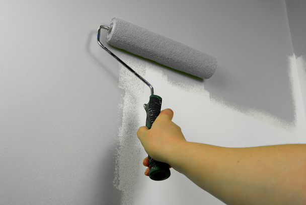Hand painting wall in grey - Photo, Image