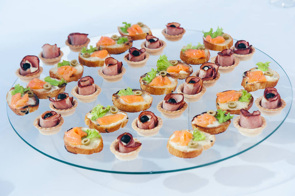 canape set with salmon fish and meat at luxury reception. catering food - Photo, Image