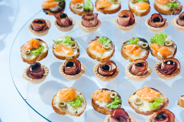 canape set with salmon fish and meat at luxury reception. catering food - Photo, image