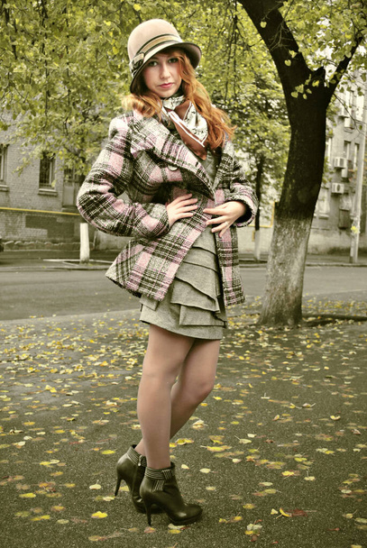 Autumn fashionable style, girl in coat at city, portrait of young lady - Photo, Image