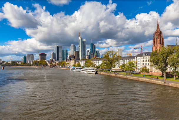 Stunning of the skyline of Frankfurt am Main with skyscrapers and mordern buildings on the river bank of Main, with magnificent cloudscape, Hesse, Germany - Photo, Image