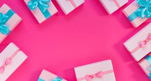 Set of beautiful gift boxes with blue bows on pink background. Holiday sale - Foto, Imagem