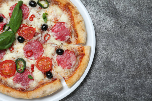 Delicious pizza Diablo on dark background, top view. Space for text - Zdjęcie, obraz