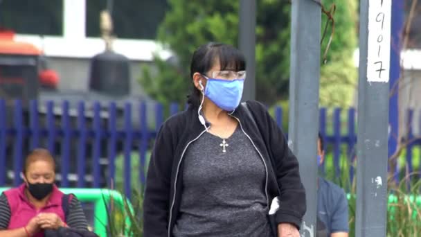 A woman wearing face mask - Filmati, video
