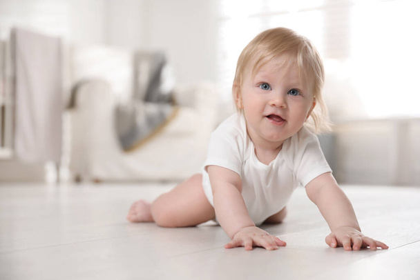 Cute little baby on floor at home - Φωτογραφία, εικόνα