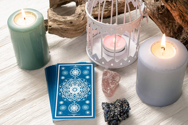 Blue tarot cards on white wooden table background. - Фото, изображение