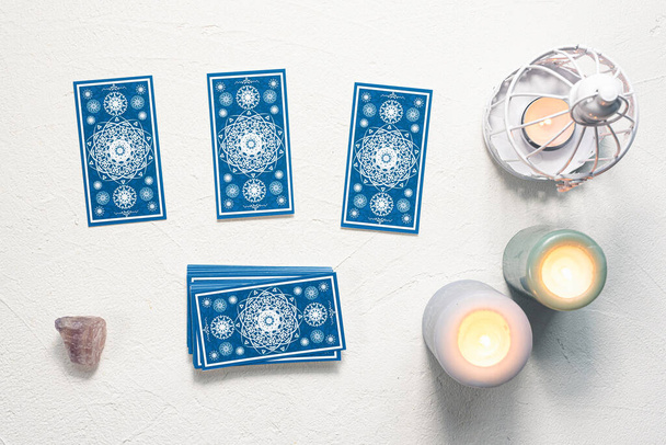 Blue tarot cards on white stone table background. - Foto, imagen