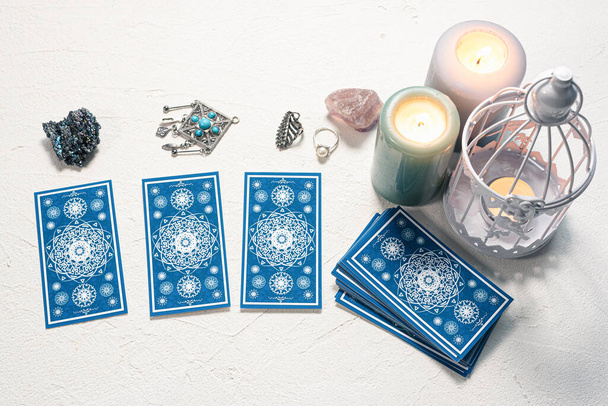 Blue tarot cards on white stone table background. - Foto, imagen