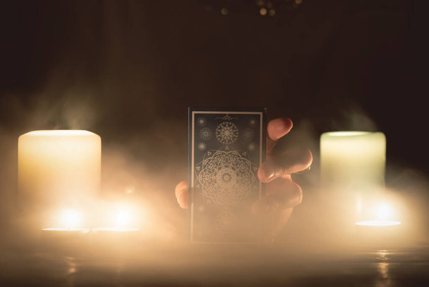 Fortune teller with tarot cards in hands close up. Future reading concept. - Foto, Imagen