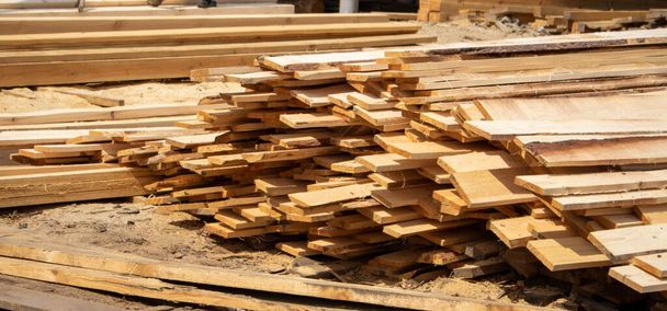 Wooden factory stock, lumber for export lies in the open air. - Photo, Image