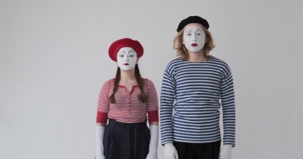 Two mime artist gesturing with finger on lips - Footage, Video