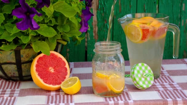 Making homemade lemonade from lemon and grapefruit. - Footage, Video