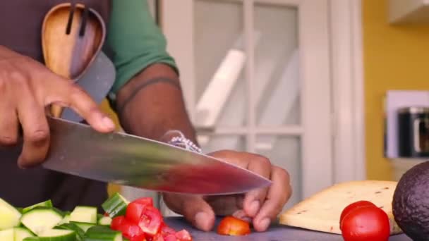 Chef preparing organic vegetables for delicious dish in kitchen - Video, Çekim