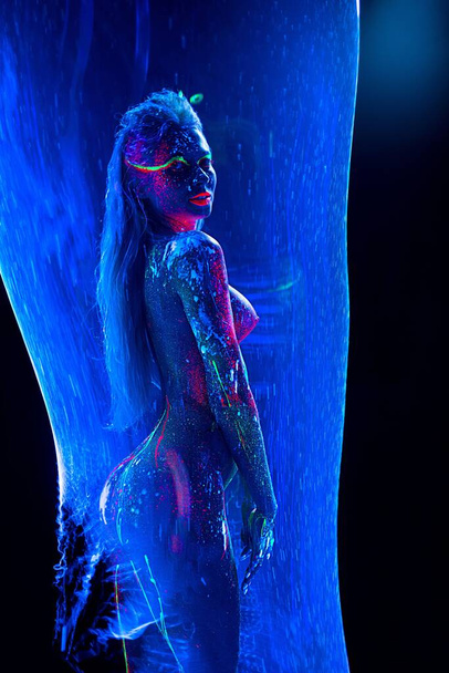 Woman with body art in blue tube - Zdjęcie, obraz