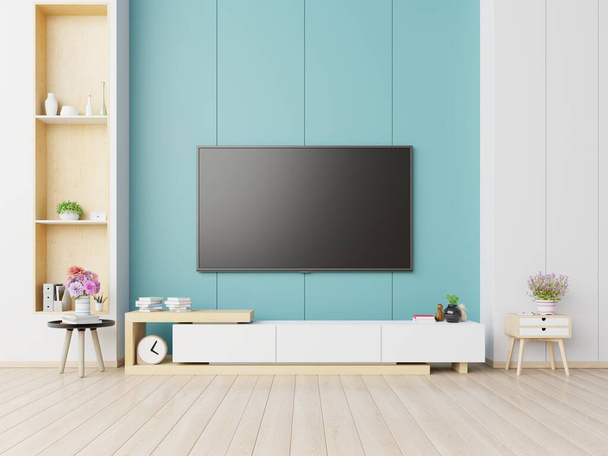 TV na szafie w nowoczesnym salonie mają rośliny i książki na tle niebieskiej ściany, 3d renderowania - Zdjęcie, obraz