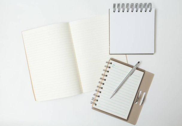 Top view of Pen, notebook on white background - Φωτογραφία, εικόνα
