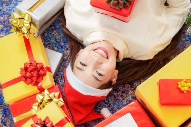 Merry Christmas and Happy Holidays concept. Happy Female with gift box. Christmas gift giving festival. Female giving Christmas present box indoors. - Foto, afbeelding