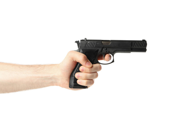 Мужчина держит черный пистолет, изолированный на белом фоне
 - Фото, изображение