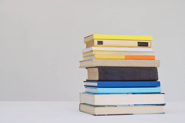 Stack of books on white background - Zdjęcie, obraz