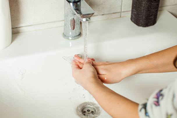 Close-up girls hands while washing with running water - Valokuva, kuva