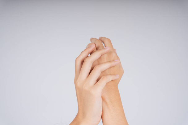 Female hands scrubbing together on white background. - Foto, imagen